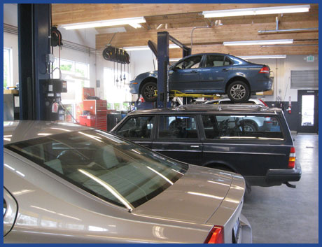 Three Volvo cars in shop 
